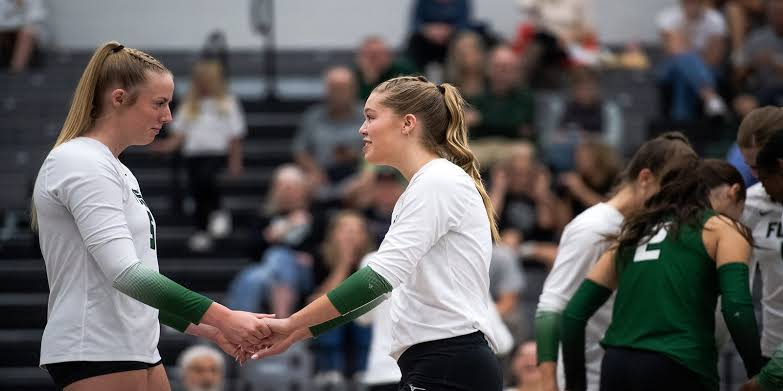 Colorado volleyball teammates shaking hands before serve during a 2026 season home match