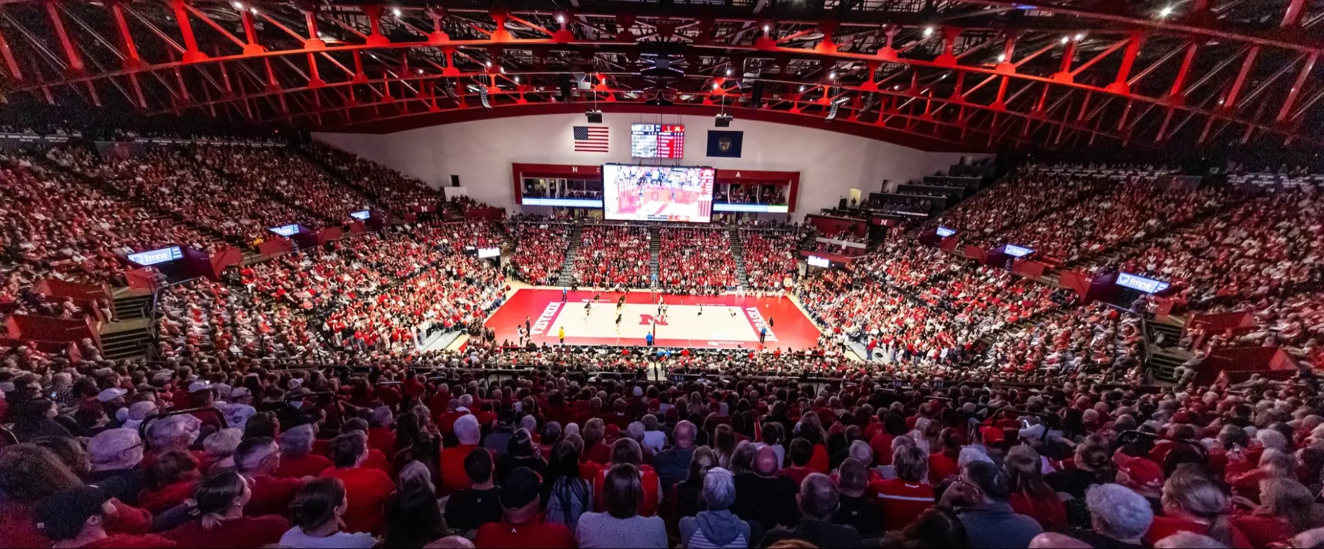 Packed Bob Devaney Sports Center crowd watching a Nebraska volleyball match on the 2026 schedule