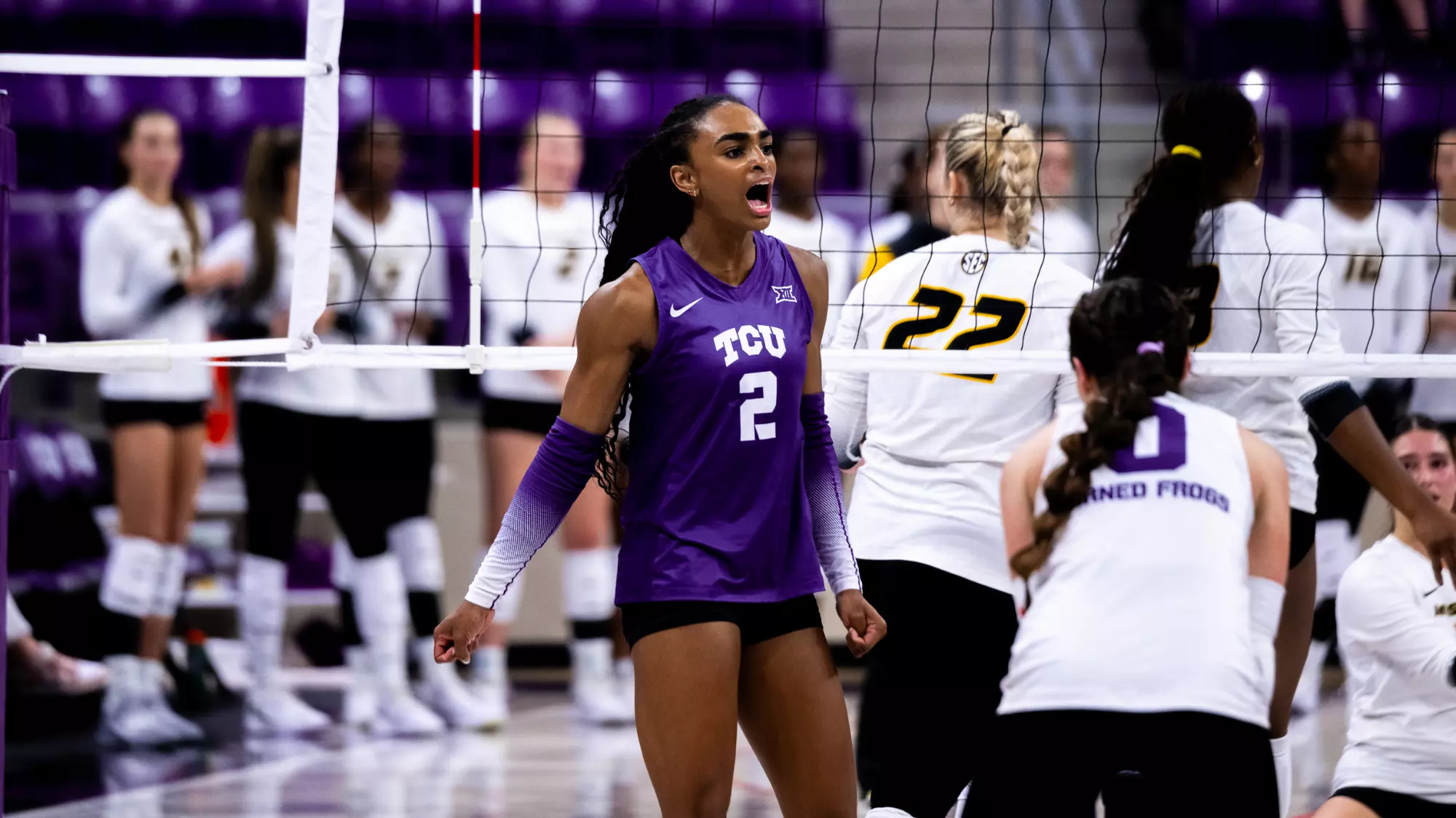 TCU volleyball player No. 2 fired up at the net during a match against Missouri