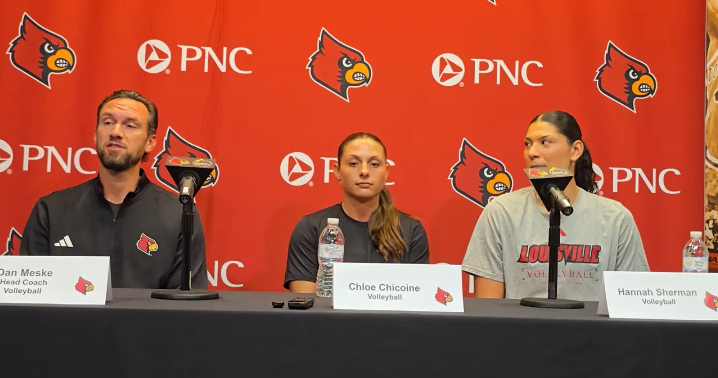 Louisville volleyball head coach Dan Meske with Chloe Chicoine and Hannah Sherman at the 2026 preseason press conference