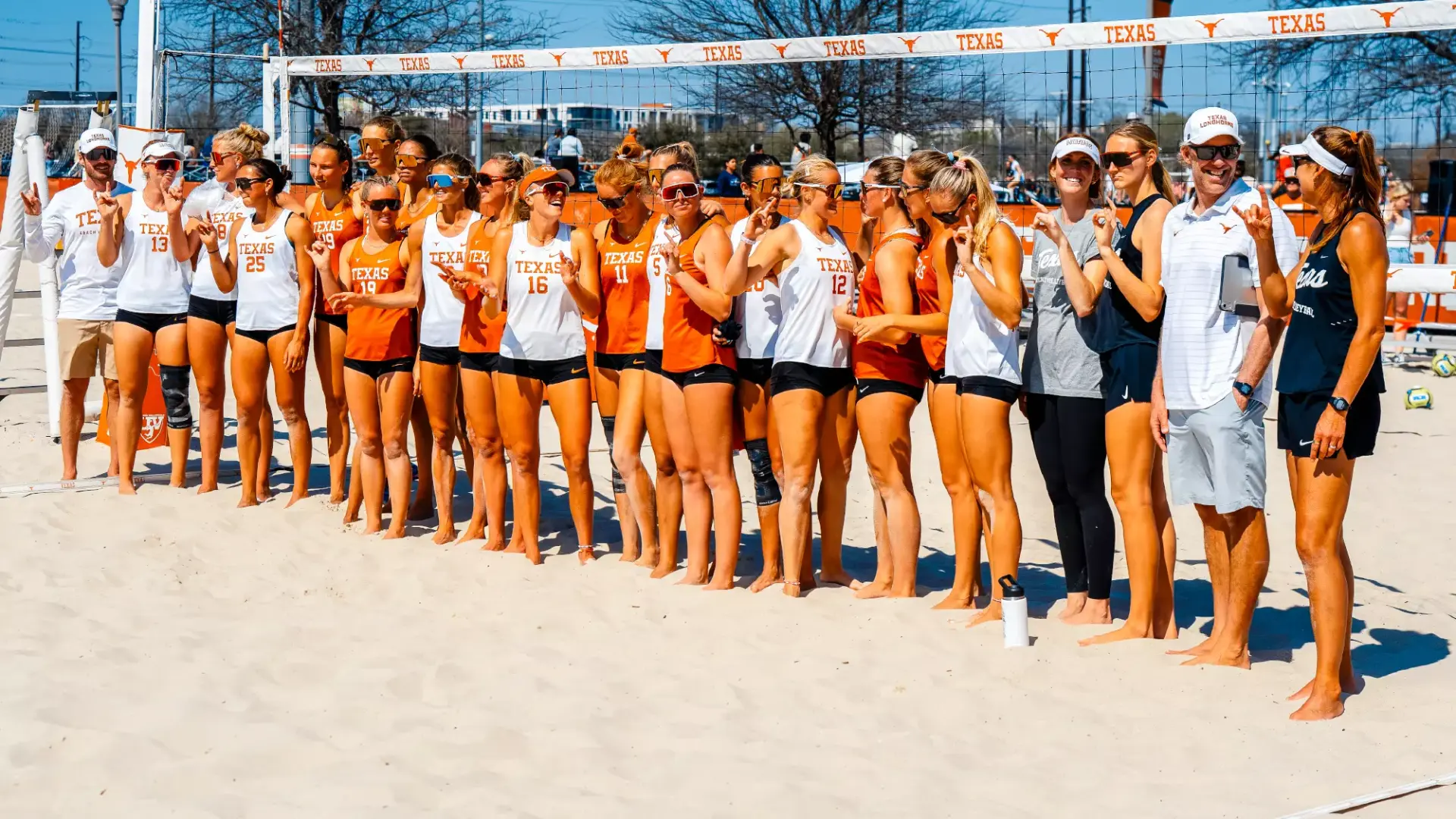 Texas Longhorns volleyball team and coaches posing together for a 2026 preseason team photo in Austin