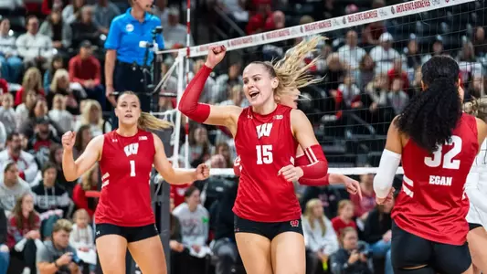 Wisconsin volleyball player number 15 celebrating a point against Ohio State during a Big Ten match