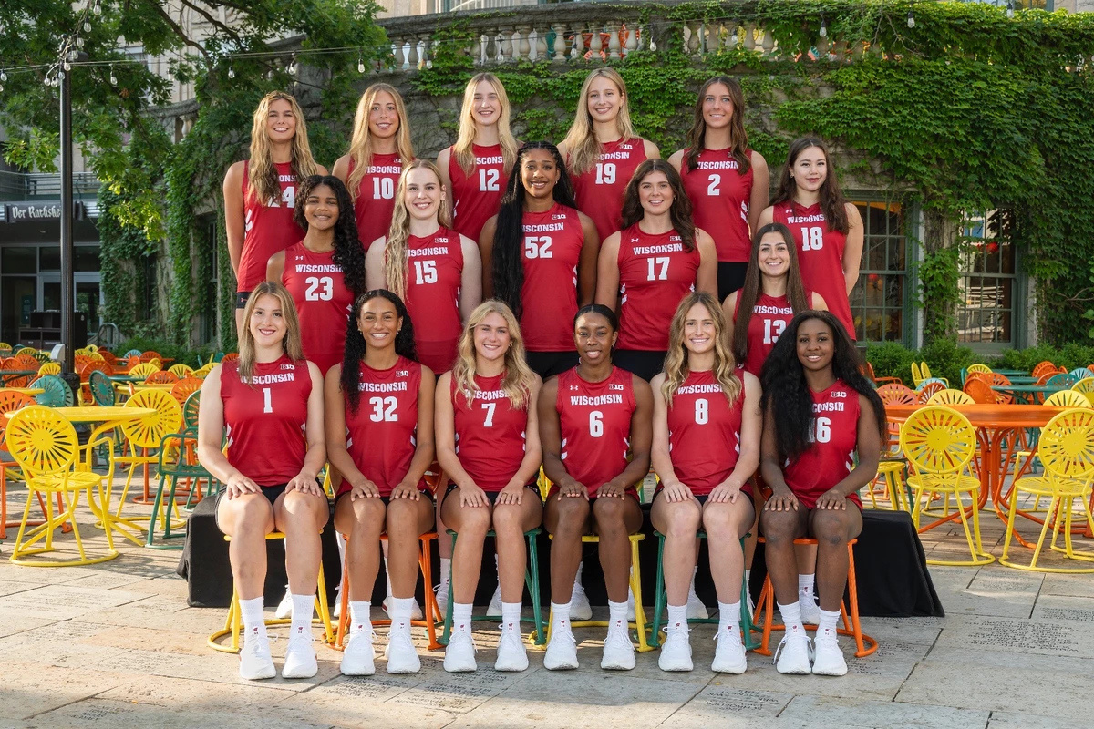 Wisconsin Badgers volleyball 2026 team photo in red jerseys posed outdoors on the Memorial Union Terrace
