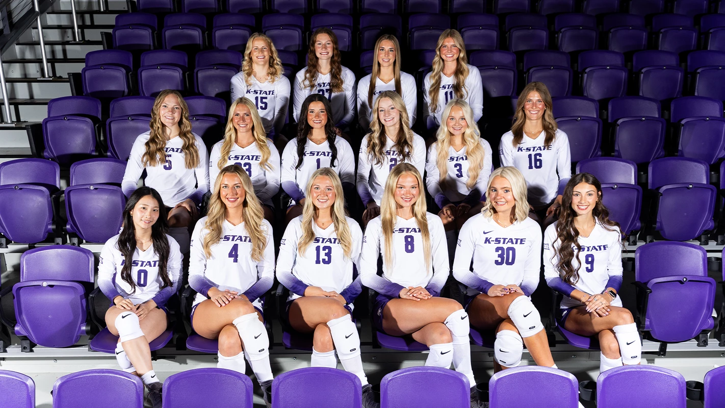 Kansas State Wildcats volleyball 2026 team photo seated in the purple arena stands before the Big 12 season