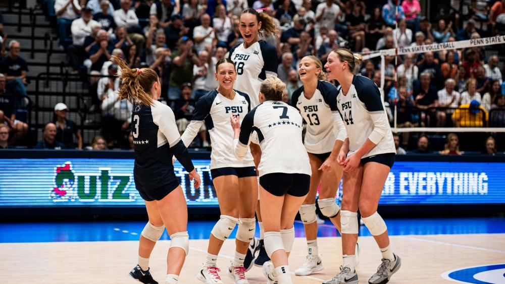 Penn State volleyball players celebrating a point together at Rec Hall during the 2026 season
