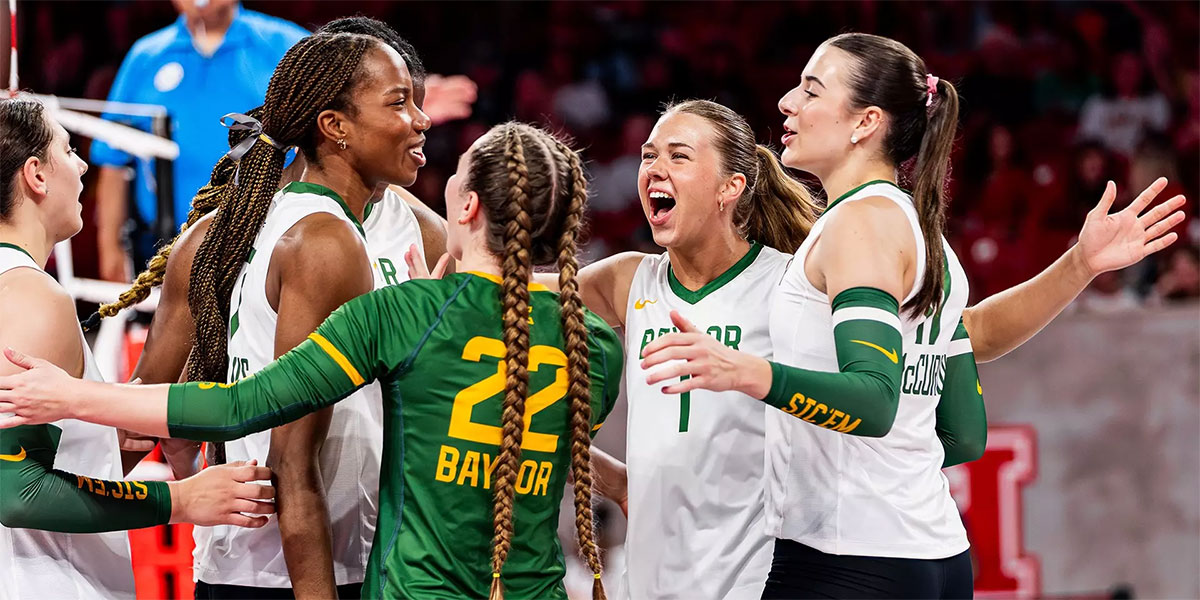 Baylor volleyball players celebrating a point together in white and green uniforms on the 2026 schedule