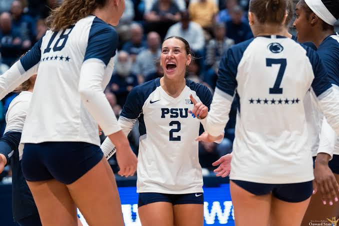 Penn State volleyball player number 2 shouting in celebration with teammates during a 2026 Big Ten match