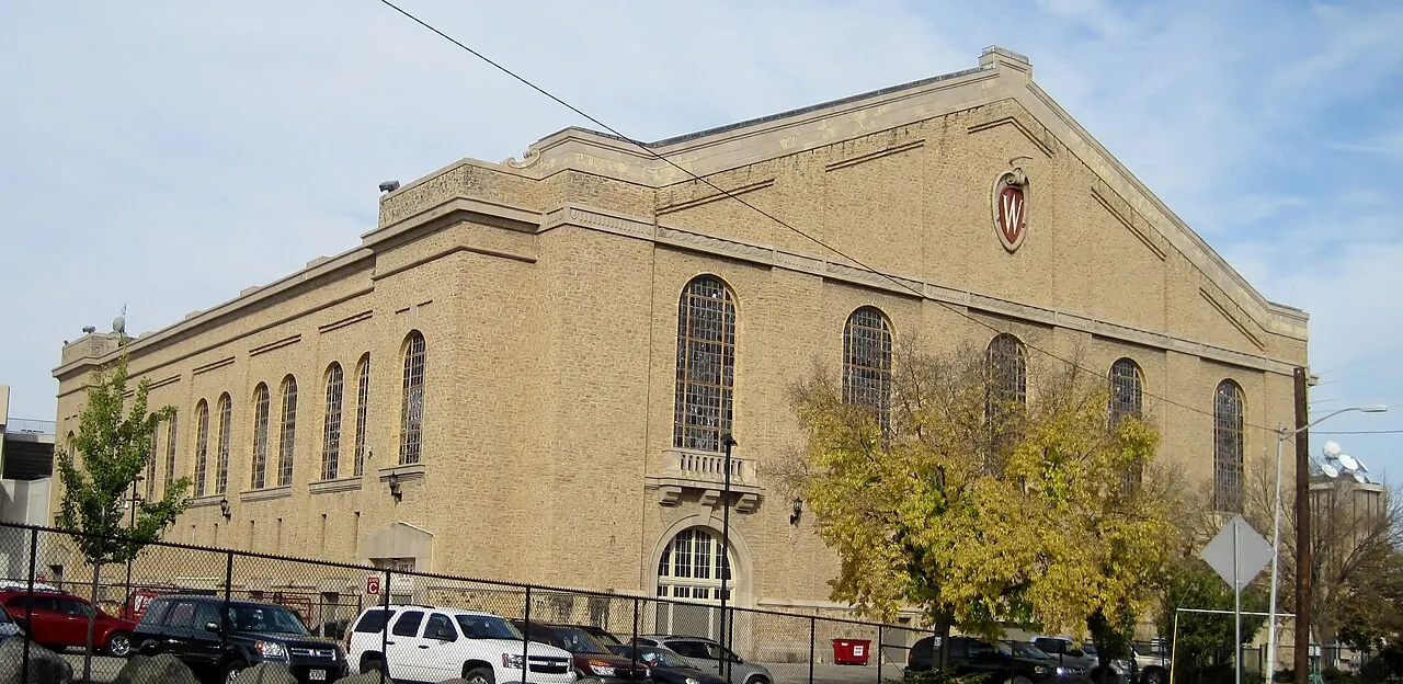 Stone exterior and arched upper windows of the University of Wisconsin Field House.